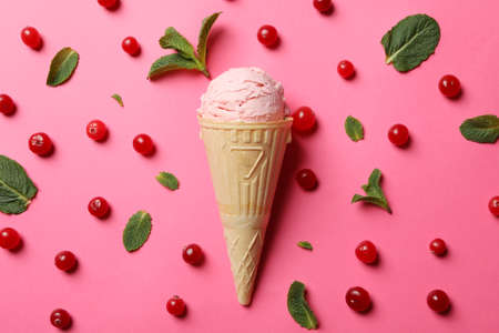 Ice cream and berries on pink background. Sweet food