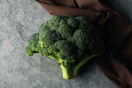Broccoli and towel on grey background, close up. Healthy foodの写真素材