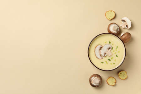 Mushroom cream soup on beige background, top viewの写真素材