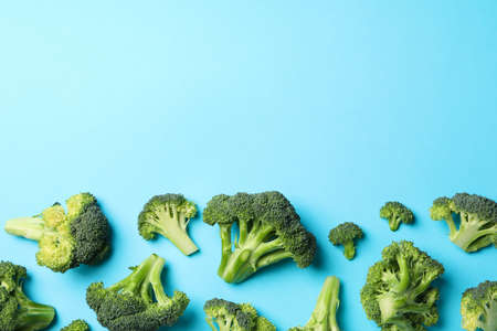 Broccoli on blue background, top view. Healthy foodの写真素材