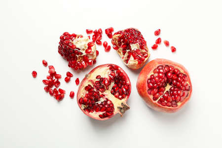Pomegranate and seeds on white background, top viewの写真素材