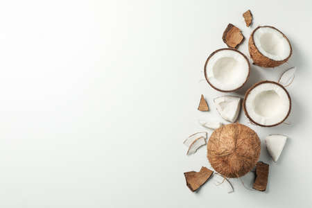 Coconut on white background, top view and space for text