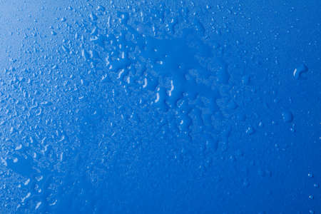 Blue background with water, top view. Wet backgroundの写真素材