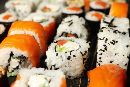 Delicious sushi rolls on wooden background, close up Japanese foodの写真素材