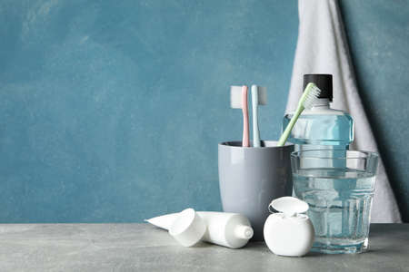Tools for dental care on blue background, space for text