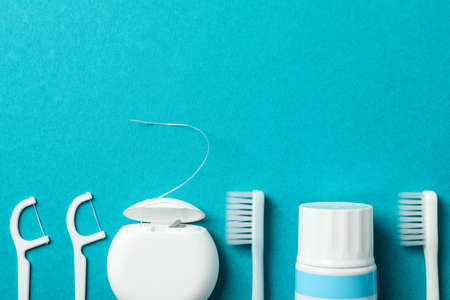 Tools for dental care on turquoise background, space for textの写真素材