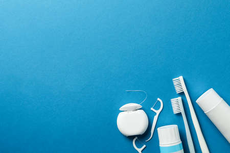 Tools for dental care on blue background, space for textの写真素材