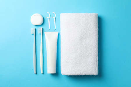 Flat lay with tools for dental care on blue backgroundの写真素材