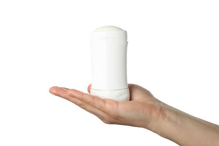 Female hand holds body deodorant, isolated on white backgroundの写真素材