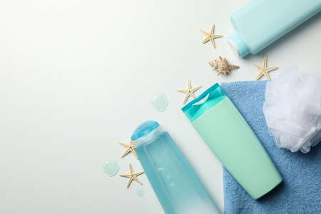 Composition with blank cosmetic bottles and starfishes on white backgroundの写真素材