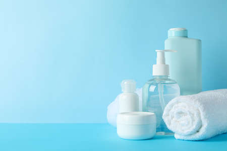 Body care products on blue background. Personal hygieneの写真素材