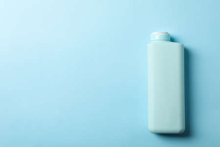 Blank shampoo bottle on blue background, space for textの写真素材
