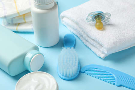 Baby hygiene accessories on blue background, close upの写真素材