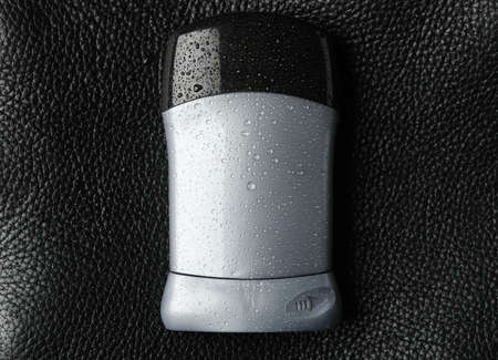 Body deodorant on black background, blank space for textの写真素材