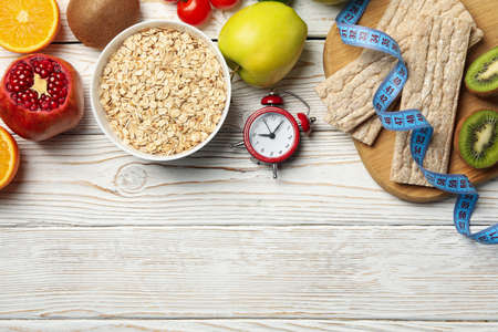 Weight loss accessories on wooden background, top viewの写真素材
