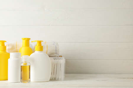 Baby hygiene accessories on white wooden backgroundの写真素材