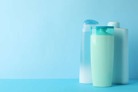 Blank bottles for cosmetics on blue backgroundの写真素材