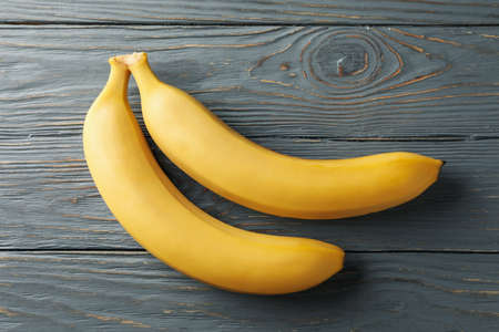 Bananas on gray wooden background. Fresh fruitの写真素材