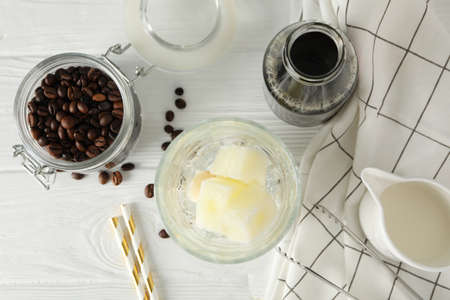 Composition with ice coffee on white wooden backgroundの写真素材