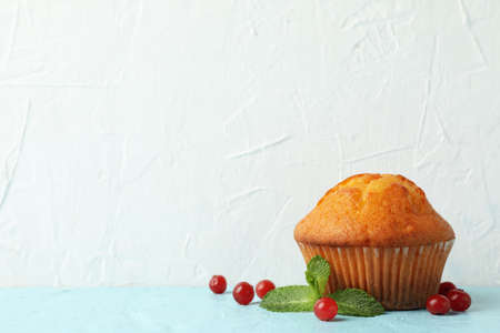 Delicious muffin and berries on white background. Sweet food
