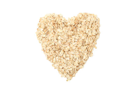 Heart made of oatmeal flakes isolated on white background
