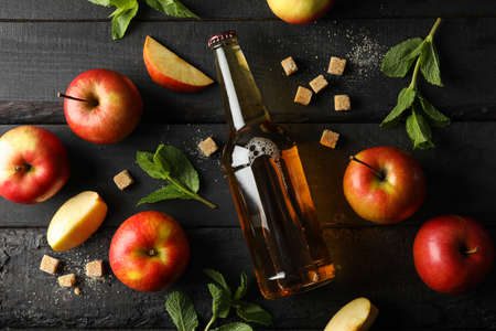 Composition with cider, sugar and apples on wooden backgroundの写真素材
