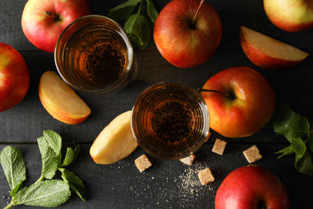 Composition with cider, sugar and apples on wooden backgroundの写真素材