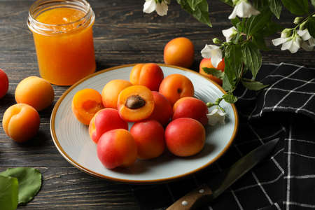 Composition with apricots and jam on wooden backgroundの写真素材
