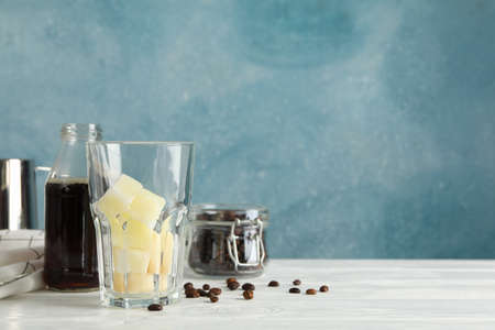 Composition with ice coffee on white wooden backgroundの写真素材