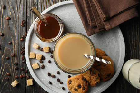 Composition with ice coffee and cookies on wooden backgroundの写真素材