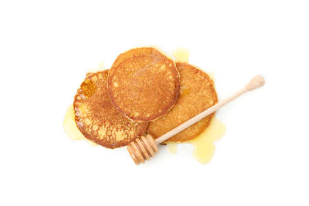 Tasty pancakes with honey isolated on white background. Sweet breakfastの写真素材