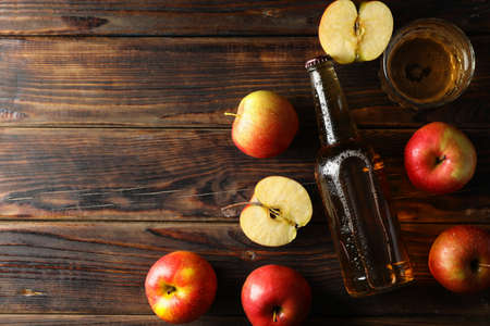 Composition with cider and apples on wooden backgroundの写真素材