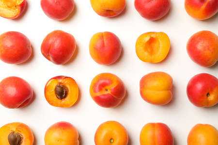 Flat lay with tasty apricots on white background, top viewの写真素材