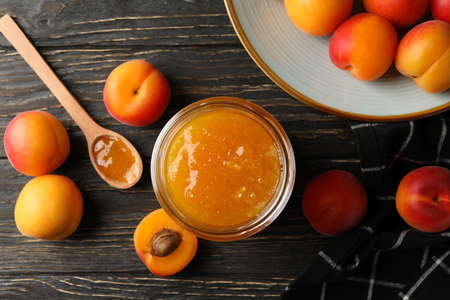 Composition with apricots and jam on wooden backgroundの写真素材