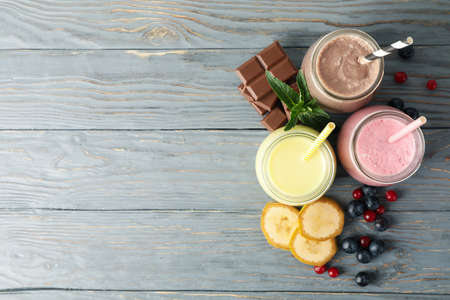 Delicious milkshakes on wooden background. Summer drinkの写真素材