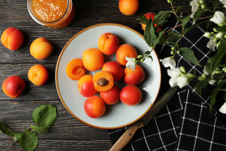 Composition with apricots and jam on wooden backgroundの写真素材
