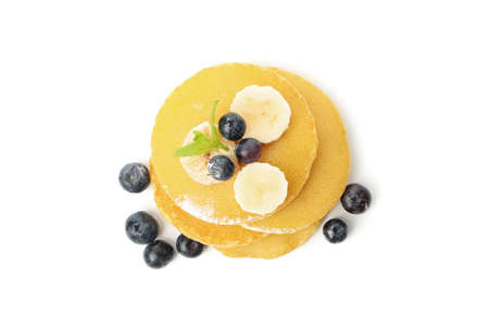 Tasty pancakes with fruits isolated on white background