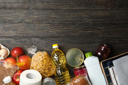 Different food on wooden background, top view. Donation conceptの写真素材