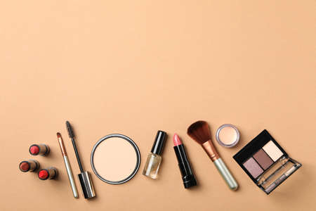 Different makeup cosmetics on brown background. Female accessoriesの写真素材