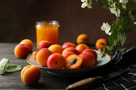 Composition with apricots and jam on wooden backgroundの写真素材