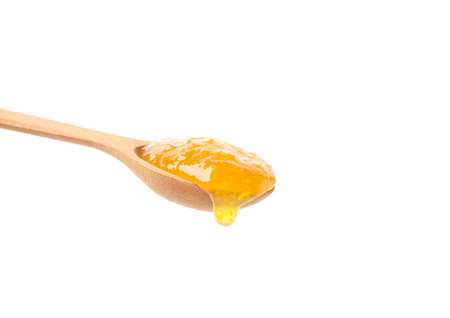 Spoon with apricot jam isolated on white backgroundの写真素材