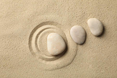 Stones on the sand with patterns. Zen concept