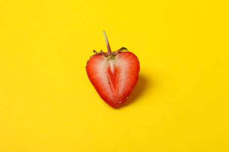 Tasty strawberry on yellow background. Summer berryの写真素材