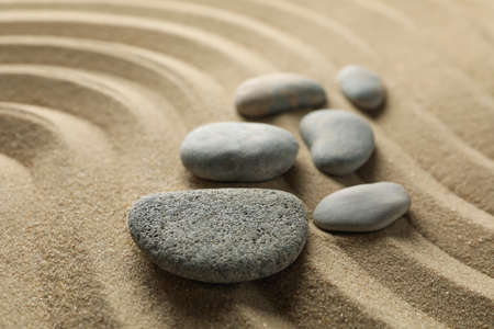 Stones on the sand with patterns. Zen concept