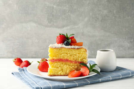 Composition with delicious berry cream cake against gray background. Tasty dessertの写真素材