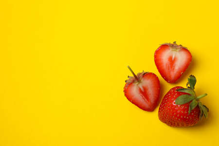 Tasty strawberry on yellow background. Summer berryの写真素材