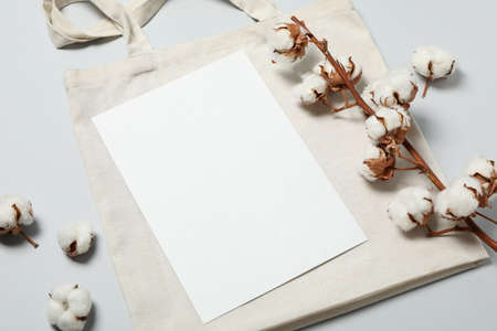 Cotton,bag and empty sheet on light gray background, space for textの写真素材