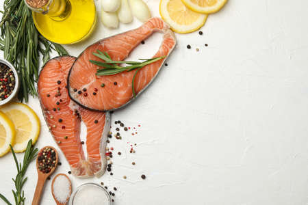 Composition with salmon meat and spices on white background, top viewの写真素材
