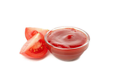 Glass bowl with tomato sauce isolated on white background