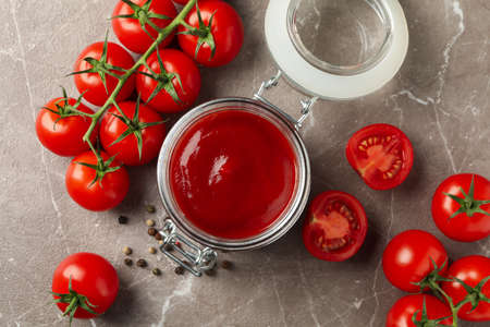 Composition with tomatoes on gray background. Ripe vegetableの写真素材